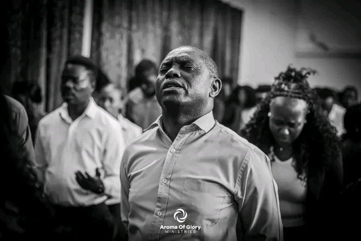 Black and white worship moment at Aroma of Glory Ministries